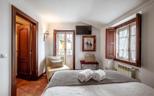 Cama ou camas em um quarto em Casa de S. Thiago de Obidos