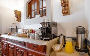 a kitchen with a counter with a coffee maker on it at Casa de S. Thiago de Obidos in Óbidos