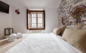 Cama ou camas em um quarto em Casa de S. Thiago de Obidos