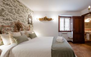 Cama ou camas em um quarto em Casa de S. Thiago de Obidos