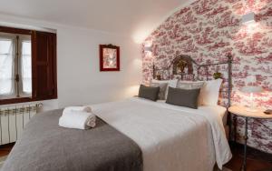 Cama ou camas em um quarto em Casa de S. Thiago de Obidos