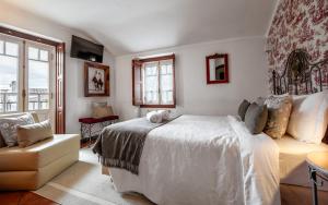 Cama ou camas em um quarto em Casa de S. Thiago de Obidos
