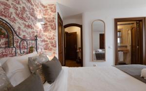 Cama ou camas em um quarto em Casa de S. Thiago de Obidos