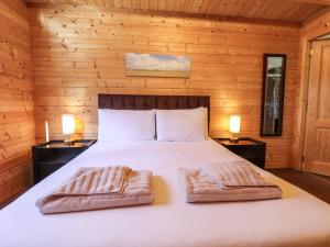 Postel nebo postele na pokoji v ubytování iLodge 73