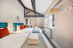 a bedroom with a large bed and a window at Host & Stay - The Coachouse at Pilgrim St in Liverpool