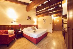 Postel nebo postele na pokoji v ubytování iH Hotels Courmayeur Mont Blanc