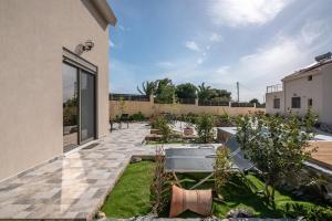 Fotografie z fotogalerie ubytování Pink Sand Villas v destinaci Agios Padeleimon + 38 fotografií