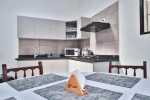 a kitchen with a table with a book on it at Apartament in Santa Rosa de Cabal in Santa Rosa de Cabal