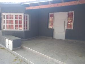 an empty room with a white door and windows at El Sarmiento M & L Mendoza in Las Heras