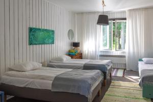 Tempat tidur dalam kamar di Saarjärve Puhkemaja 16-le 4 magamistuba
