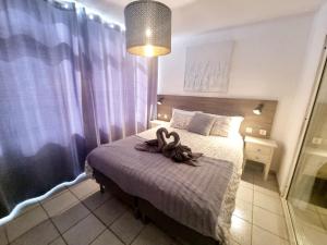 Postel nebo postele na pokoji v ubytování Luxury Apartamento Luz de Mar Complejo Playa Roca