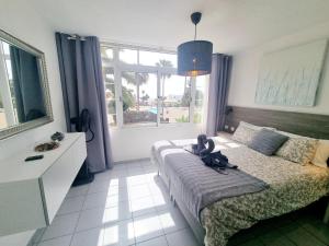 Postel nebo postele na pokoji v ubytování Luxury Apartamento Luz de Mar Complejo Playa Roca