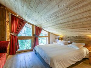 a bedroom with a large bed and a large window at Appartement Val-d'Isère, 5 pièces, 8 personnes - FR-1-694-11 in Val-d'Isère