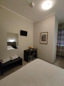 Postel nebo postele na pokoji v ubytování Hotel Salus