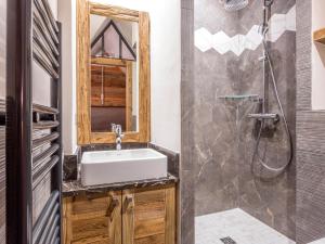 a bathroom with a sink and a shower at Appartement luxe avec wifi et parking sur les pistes au cœur de Val-d'Isère - FR-1-694-133 in Val dʼIsère +9 photos