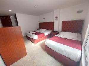 Postel nebo postele na pokoji v ubytování Hotel Cabrera Real