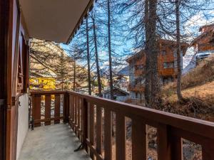 a view from the balcony of a house at Studio de standing calme à Val-d'Isère, proche du centre, sans WIFI ni parking - FR-1-694-288 in Val dʼIsère +3 photos