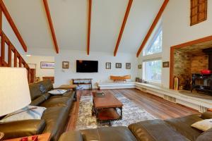 a large living room with a couch and a tv at Mudge Ranch Retreat near Bass Lake with EV Charger in Coarsegold