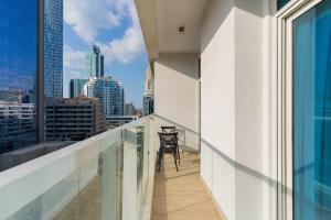 a balcony with a view of the city at LUXFolio Retreats - In The Heart Of Marina in Dubai Marina
