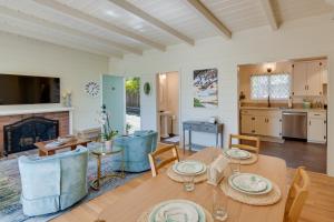 a dining room and living room with a table and chairs at Vacation Rental Home about 1 Mi to Carmel Beach! in Carmel