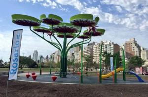a playground with a flower sculpture in a park at Loft Espectacular Céntrico con Garaje in Rosario