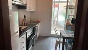 Kuchyň nebo kuchyňský kout v ubytování apartamento centrico cambados + 13 fotografií