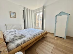 Posteľ alebo postele v izbe v ubytovaní Le plage de Notre-Dame - Appartement au coeur de la vieille ville