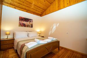 A bed or beds in a room at Natasa's cozy house