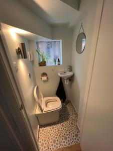 a small bathroom with a toilet and a sink at 29 park avenue in Shoreham-by-Sea