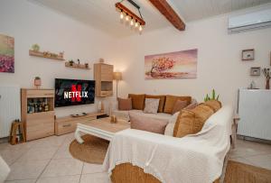 A television and/or entertainment centre at Natasa's cozy house