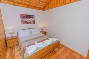 A bed or beds in a room at Natasa's cozy house