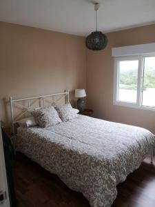 Postel nebo postele na pokoji v ubytování La casina del hórreo