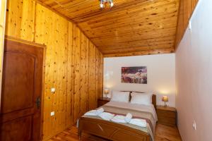 A bed or beds in a room at Natasa's cozy house