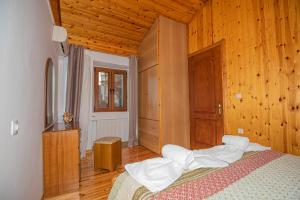 A bed or beds in a room at Natasa's cozy house