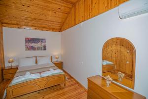 A bed or beds in a room at Natasa's cozy house