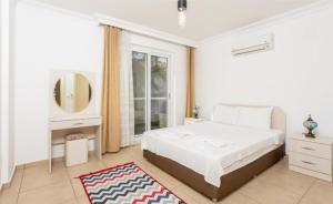 Postel nebo postele na pokoji v ubytování Villa Canberk