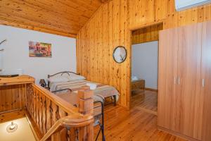 A bed or beds in a room at Natasa's cozy house