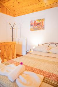 A bed or beds in a room at Natasa's cozy house