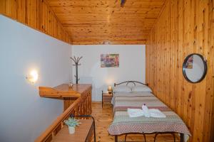 A bed or beds in a room at Natasa's cozy house