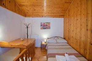A bed or beds in a room at Natasa's cozy house
