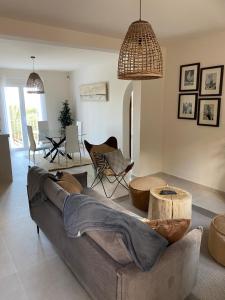 a living room with a couch and a table at Casa El Sueño in Jávea