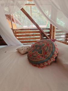 a decoration on a bed with a white canopy at La Casa en el Aire in Palomino