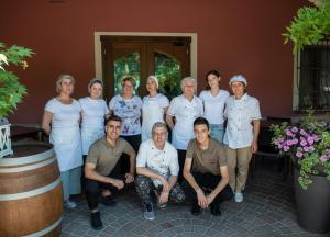 a group of people posing for a picture in a room at Madonna della Neve in Cessole