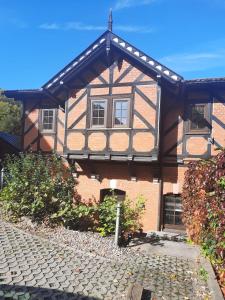 a large brick house with a gambrel at Ferienhaus Renate in Meiningen