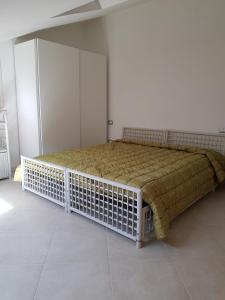a bedroom with a large bed in a room at La Mansarda di Corso Umberto in Pescara