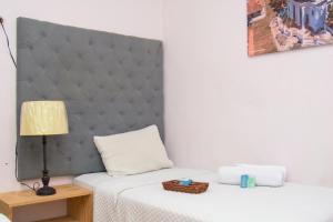 Ein Bett oder Betten in einem Zimmer der Unterkunft Velvet Hostal La novena
