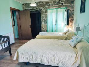 Letto o letti in una camera di Casa Cabreiros de Baixo