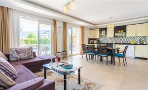 a living room with a couch and a table at Villa Günsu in Ortaca