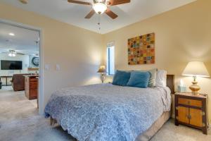 a bedroom with a bed and a ceiling fan at Sleek Apartment in the Heart of Denver Tech Center in Englewood