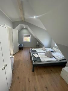 a bedroom with a bed in a attic at Ferienwohnungen mitten in Hamburg in Hamburg